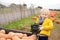 Cute little boy choosing organic squash on agricultural farm at autumn