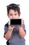 Cute little boy demonstrating blank screen smartphone in hands,