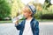 Cute little boy drinking water from the plastic bottle. Child drinks water outdoor