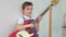 Cute little boy with electronic guitar