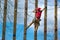 Cute little boy enjoying her time in climbing adventure park