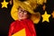 Cute little boy in glasses and sky watcher costume