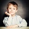 Cute Little Boy. Happy Child on Blackboard