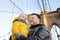 Cute little boy and his father on Brooklyn Bridge with skyscrapers on background