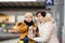 Cute little boy and his grandmother/mother waiting express train on railway station platform