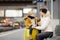 Cute little boy and his grandmother/mother waiting express train on railway station platform