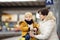 Cute little boy and his grandmother/mother waiting express train on railway station platform