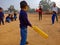 a cute little boy holded cricket bat in the ground in India January 2020