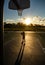 Cute little boy holding a basket ball trying make a score.