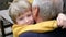 Cute little boy hugging his grandfather, summer outdoors