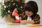Cute little boy making paper Saint Nicholas toy