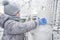 Cute little boy is making a snowman. Child playing with snow. Children wintertime outdoor activitie time concept