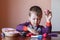 Cute little boy playing with many-colored plasticine. Boy playing with toys Dental Tools. Facial expression. Positive, negative