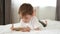 Cute little boy playing using smartphone. The child looks at the smartphone screen and laughs. Applications for the