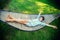 Cute little boy relaxing in a hammock during summer vacation