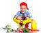 Cute little boy with scoop, fresh organic vegetables and watering can