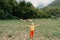 Cute little boy with a sheeps on farm, best friends, boy and lamb against the backdrop of greenery, poddy and child on