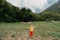 Cute little boy with a sheeps on farm, best friends, boy and lamb against the backdrop of greenery, poddy and child on