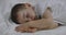 Cute Little Boy is Sleeping Sweetly in Bed, Concept of Baby Sleep.