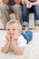 Cute little boy watching television on the floor