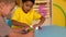 Cute little boys playing with modelling clay in classroom