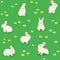 Cute little bunnies in the spring flower meadow seamless pattern
