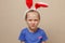 Cute little child girl wearing bunny ears on Easter day.