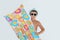 Cute little child with inflatable mattress on white background. Beach holiday