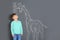 Cute little child measuring height near chalk giraffe drawing