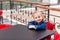 Cute little child sitting in a cafe in shopping mall