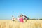 Cute little children with kite in field on sunny day