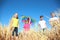 Cute little children with kite in field on sunny day