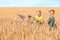 Cute little children with kite in wheat field on sunny day