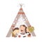 Cute little children play in a tent teepee