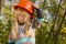 Cute little girl adjusting her hardhat