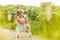 Cute little girl with blonde hair drinking lemonade outdoor. Detox fruit infused flavored water, cocktail in a beverage