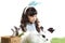 Cute little girl with blue bunny ears playing with rabbits while lying on green grass. Joyful kid with her pet celebrating Easter