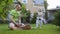 Cute little girl bring pot with flowers to her father