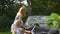 Cute little girl with brush helping her mother washing car automobile outdoor.