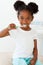 Cute little girl brushing her teeth