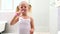 Cute little girl brushing her teeth