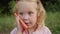 Cute little girl calls by mobile phone and fun talks