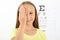 Cute little girl checks eyesight with an ophthalmologist. eyesight test