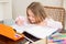 Cute little girl colouring at the table