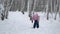 Cute Little Girl Cross Country Skiing in a Park
