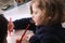 Cute little girl drawing with her mother.