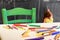 Cute little girl drawing and painting at kindergarten. Creative activities kids club