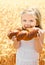 Cute little girl eating bread