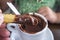 Cute little girl eating churros with hot chocolate