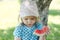 cute little girl eating watermelon outdoors in summertime. Child and watermelon in summer.